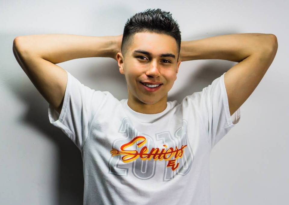 Cameron Martinez in a white t-shirt reading "Seniors EV"